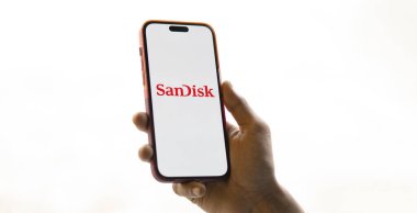 Dhaka, Bangladesh- 23 Nov 2024: Sandisk logo is displayed on smartphone. SanDisk LLC is an American multinational computer technology company. clipart