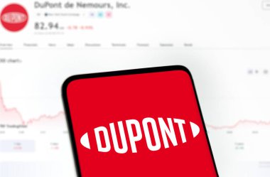 Dhaka, Bangladesh- 4 Dec 2024: Dupont logo is displayed on smartphone. DuPont is an American multinational chemical company. clipart