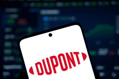 Dhaka, Bangladesh- 4 Dec 2024: Dupont logo is displayed on smartphone. DuPont is an American multinational chemical company. clipart