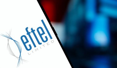 Dhaka, Bangladesh- 17 Dec 2024: eftel limited logo is displayed on smartphone. Eftel Limited was an internet service provider and telecommunications provider company. clipart