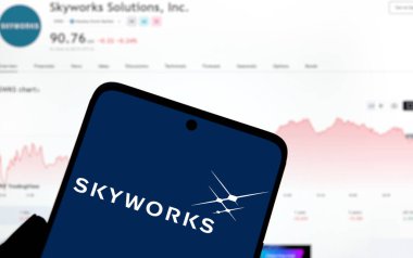 Dhaka, Bangladesh- 17 Dec 2024: skyworks logo is displayed on smartphone. Skyworks Solutions Inc is an American semiconductor company. clipart