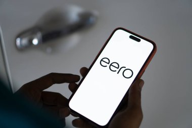 Dhaka, Bangladesh- 21 Dec 2024: Eero logo is displayed on smartphone. clipart