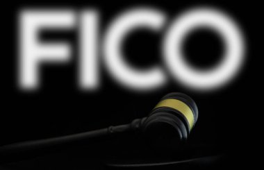 Dhaka, Bangladesh- 21 Dec 2024: Court gavel in front of the FICO logo. FICO is an American data analytics company. clipart