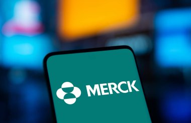 Dhaka, Bangladesh- 22 Dec 2024: Merck logo is displayed on smartphone. Merck & Co Inc is an American multinational pharmaceutical company. clipart