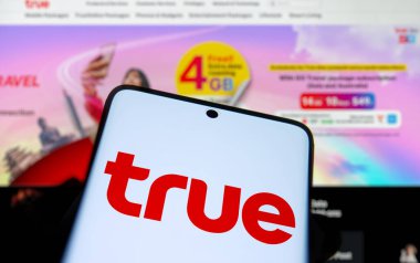 Dhaka, Bangladesh- 22 Dec 2024: true logo is displayed on smartphone. True Corporation Public Company Limited is a communications conglomerate company. clipart