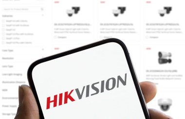 Dhaka, Bangladesh- 23 Dec 2024: Hikvision logo is displayed on smartphone. Hikvision is a leading Chinese surveillance technology company known for its wide range of video surveillance products. clipart