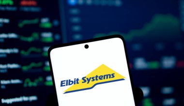 Dhaka, Bangladesh- 2 Jan 2025: Elbit systems logo is displayed on smartphone. Elbit Systems Ltd is an Israel based international military technology company. clipart