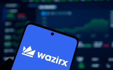 Dhaka, bangladesh- 13 Jan 2025: WazirX logo is displayed on smartphone. WazirX is an Indian cryptocurrency trading platform. clipart