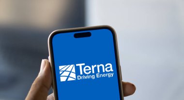 Dhaka, Bangladesh- 8 Jan 2025: Terna driving energy logo is displayed on smartphone. Terna S.p.A. is a transmission system operator. clipart