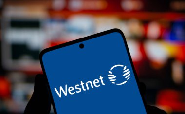 Dhaka, Bangladesh- 17 Dec 2024: Westnet logo is displayed on smartphone. Westnet is a Perth-based Australian telecommunications company. clipart