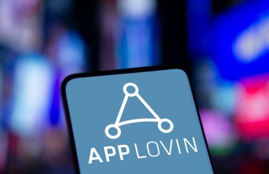 Dhaka, Bangladesh- 19 Dec 2024: App lovin logo is displayed on smartphone. AppLovin Corporation is an American mobile technology company. clipart