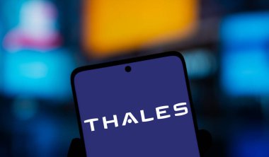 Dhaka, Bangladesh- 17 Dec 2024; Thales logo is displayed on smartphone. Thales Group is a French multinational aerospace and defence corporation specialized in electronics company. clipart