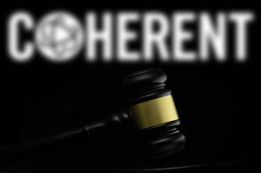 Dhaka, Bangladesh- 19 Dec 2024: Court gavel in front of the Coherent logo. Coherent Inc is an American company. clipart