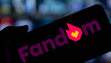 Dhaka, Bangladesh- 27 Nov 2024: Fandom logo is displayed on smartphone. Fandom is a wiki hosting service that hosts wikis mainly on entertainment topics. clipart