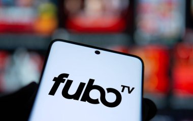 Dhaka, Bangladesh- 20 Jan 2025: fubo tv logo is displayed on smartphone. FuboTV is an American streaming television service company. clipart