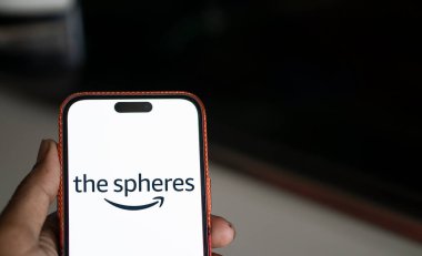 Dhaka, Bangladesh- 20 Jan 2025; The spheres logo is displayed on smartphone.  Amazon Spheres are three spherical conservatories comprising part of the Amazon. clipart