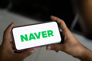 Dhaka, bangladesh- 23 Nov 2024: Naver logo is displayed on smartphone. Naver Corporation is a South Korean internet conglomerate company. clipart