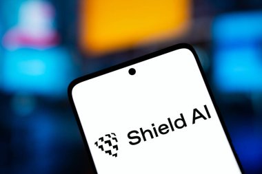 Dhaka, Bangladesh- 11 Jan 2025: Shield ai logo is displayed on smartphone. Shield AI is an American aerospace and arms technology company. clipart