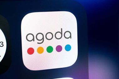 Dhaka, Bangladesh- 21 jan 2025: A close up of an iPhone screen displaying the Agoda logo. Agoda is an online travel agency. clipart