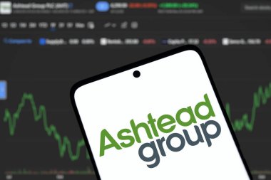 Dhaka, Bangladesh- 1 Dec 2024: Ashtead group logo is displated on smartphone.Ashtead Group Public Limited Company is a British industrial equipment rental company. clipart