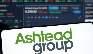 Dhaka, Bangladesh- 1 Dec 2024: Ashtead group logo is displated on smartphone.Ashtead Group Public Limited Company is a British industrial equipment rental company. clipart