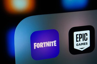 Dhaka, Bangladesh- 05 Feb 2025: A close up of an iPad screen displaying the Epic Games and Fortnite app clipart