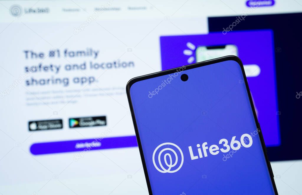 Dhaka, Bangladesh - 17 March 2025: The logo of the life 360 is displayed on a smartphone screen, and the website life 360 is visible on a computer screen in the background.