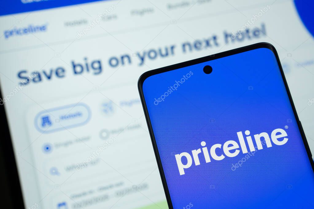 Dhaka, Bangladesh - 17 March 2025: The logo of the priceline is displayed on a smartphone screen, and the website priceline is visible on a computer screen in the background.