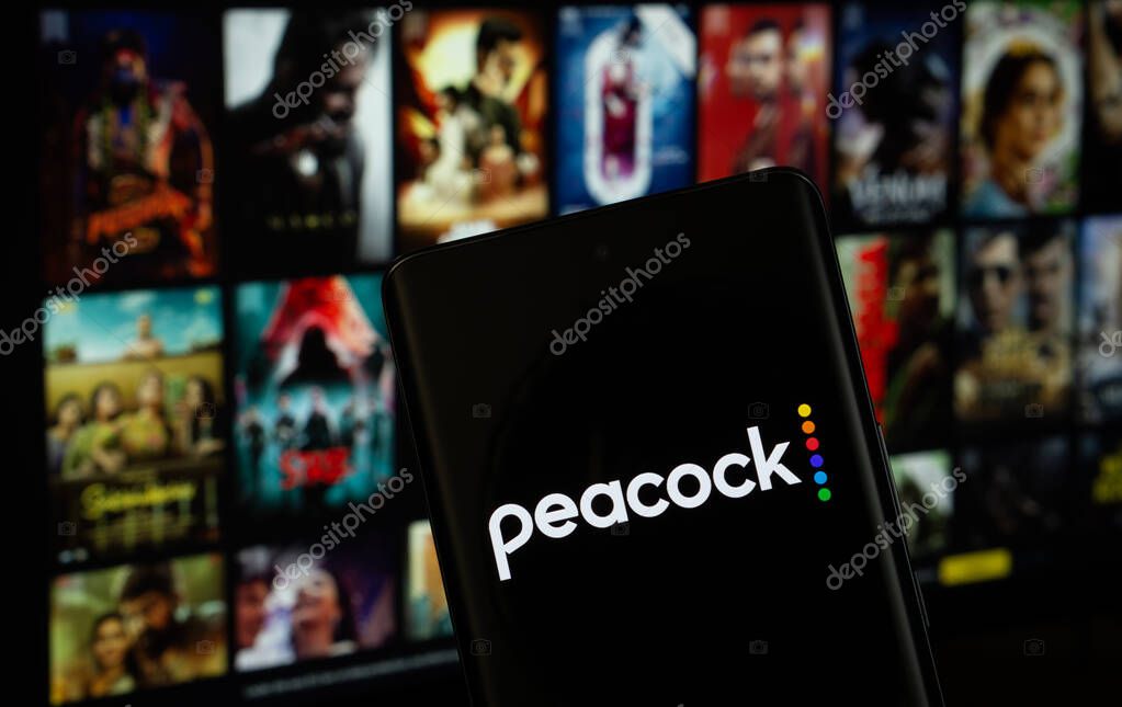 Dhaka, Bangladesh - 17 March 2025: The logo of the peacock is displayed on a smartphone screen, and the website peacock is visible on a computer screen in the background.