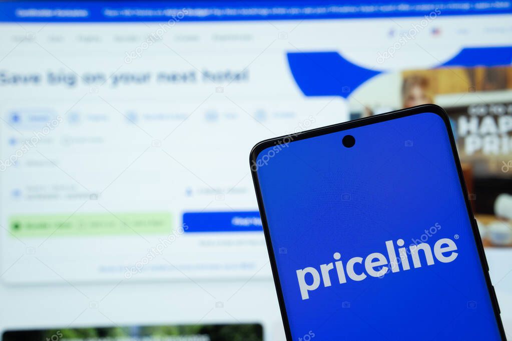 Dhaka, Bangladesh - 17 March 2025: The logo of the priceline is displayed on a smartphone screen, and the website priceline is visible on a computer screen in the background.
