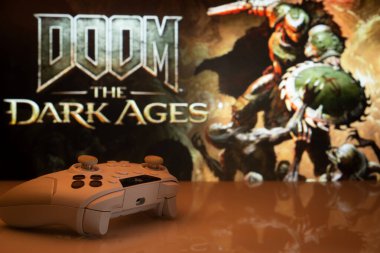 Dhaka, Bangladeş - 30 Nisan 2025: Arka planda Doom the Dark Ages (Karanlık Çağlar) adlı beyaz oyun alanının yakın çekimi.