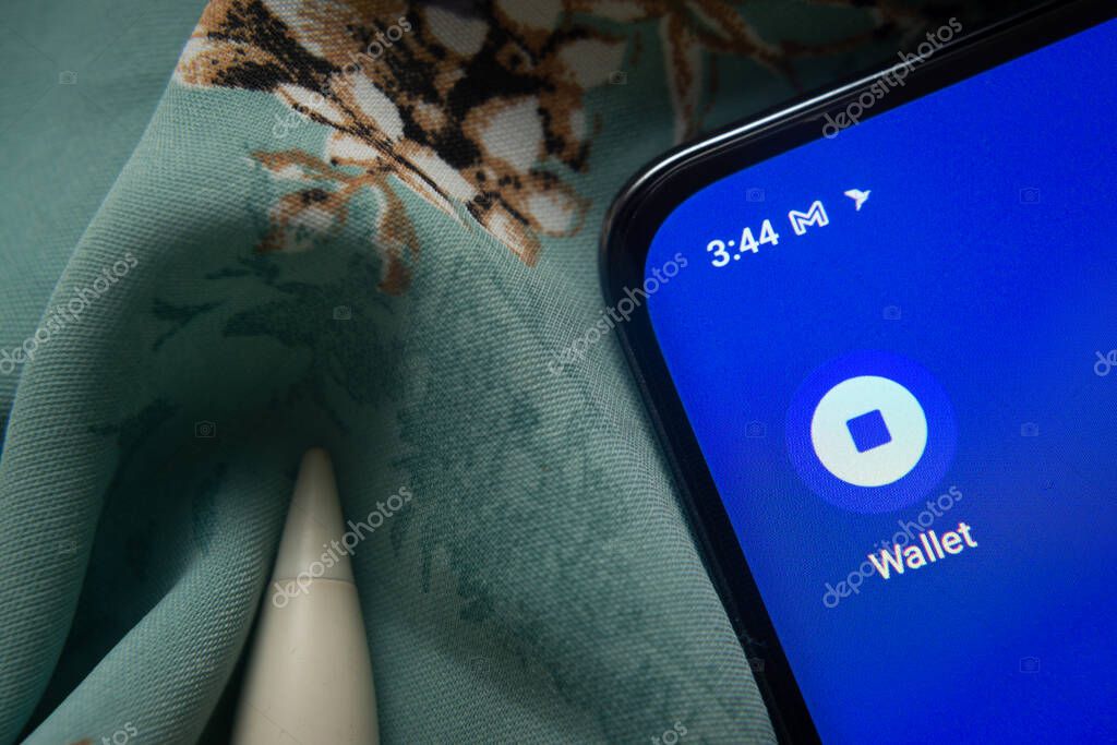Dhaka, Bangladesh- 07 May 2025: Coinbase Wallet app icon is seen on smartphone.
