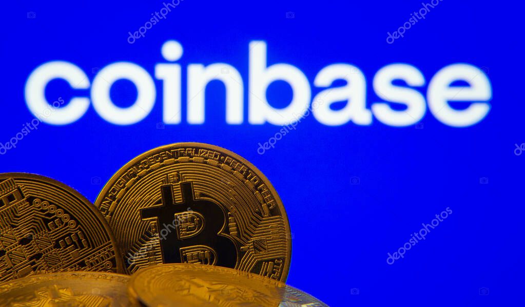 Dhaka, Bangladesh- 16 June 2025: Close-up of Bitcoin coins with the Coinbase logo visible on a screen in the background.
