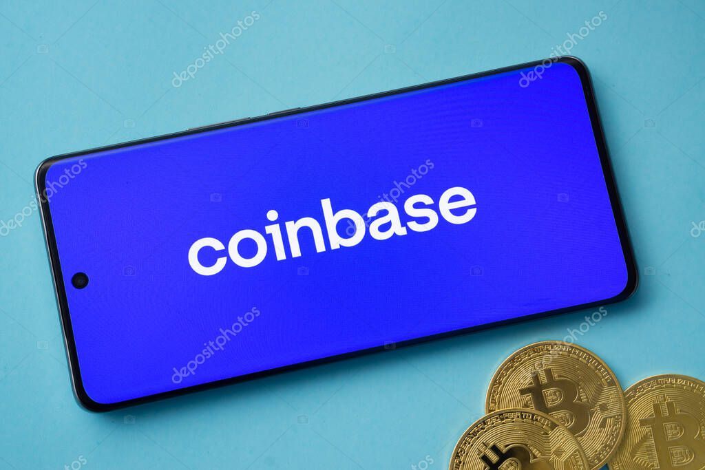 Dhaka, Bangladesh- 17 June 2025: Smartphone displaying Coinbase logo with Bitcoin coins on a blue background.