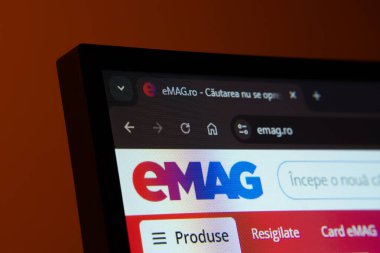 Dhaka, Bangladesh- 03 Oct 2025: Close-up of a computer screen displaying the Emag web interface in dark mode