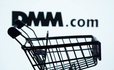 Dhaka, Bangladesh- 03 Oct 2025: Silhouette of a shopping cart in front of the Dmm.com logo, symbolizing ecommerce and online shopping