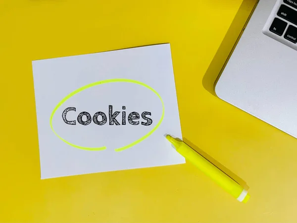 stock image cookies note on yellow background