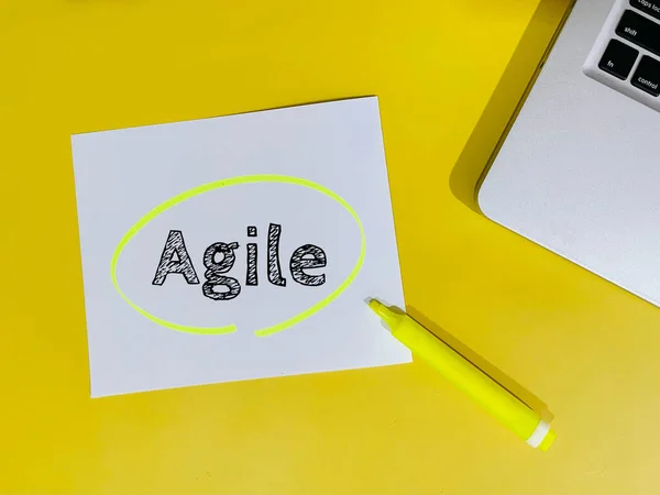 stock image agile note on yellow background