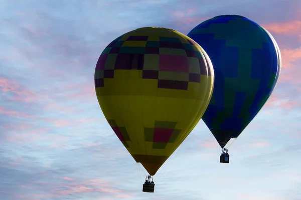Two hot air balloons are about a mile high above the Temecula valley with spectacular views all over the Southern California area.