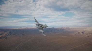 F-16 Falcon savaş uçağı çöl üzerinde uçuyor.