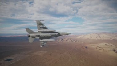 F-16 Falcon fighter jet flying over a desert landscape