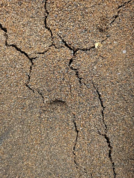 Dry and cracked soil sand ground during drought viewed from above