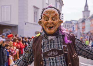 Villach, Austria - 2023 February 19: Carnival in Villach, Fasching, Participants in the annual parade wear colorful and masquerade clothing. Motto: Lei-Lei.
