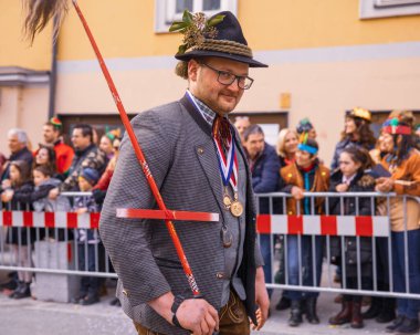 Villach, Austria - 2023 February 19: Carnival in Villach, Fasching, Participants in the annual parade wear colorful and masquerade clothing. Motto: Lei-Lei.