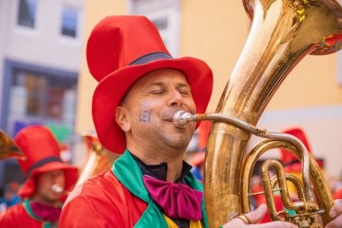 Villach, Austria - 2023 February 19: Carnival in Villach, Fasching, Participants in the annual parade wear colorful and masquerade clothing. Motto: Lei-Lei.