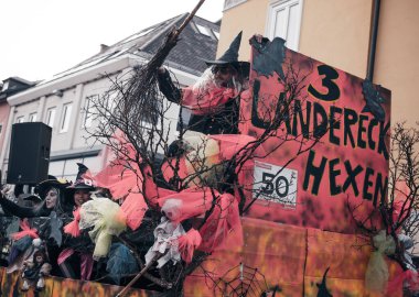 Villach, Austria - 2023 February 19: Carnival in Villach, Fasching, Participants in the annual parade wear colorful and masquerade clothing. Motto: Lei-Lei.