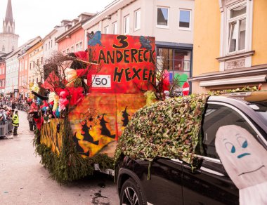 Villach, Austria - 2023 February 19: Carnival in Villach, Fasching, Participants in the annual parade wear colorful and masquerade clothing. Motto: Lei-Lei.