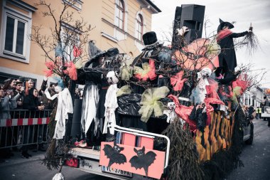 Villach, Austria - 2023 February 19: Carnival in Villach, Fasching, Participants in the annual parade wear colorful and masquerade clothing. Motto: Lei-Lei.