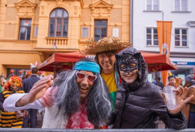 Villach, Austria - 2023 February 19: Carnival in Villach, Fasching, Participants in the annual parade wear colorful and masquerade clothing. Motto: Lei-Lei.