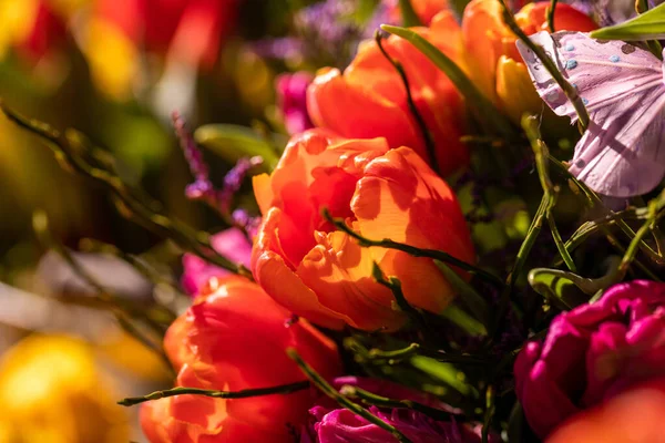 Different flowers and seedlings near the florist flower shop entrance, spring time, easter concept
